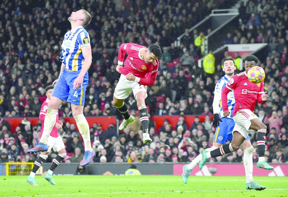 Manchester United's Cristiano Ronaldo heads at goal REUTERS/
