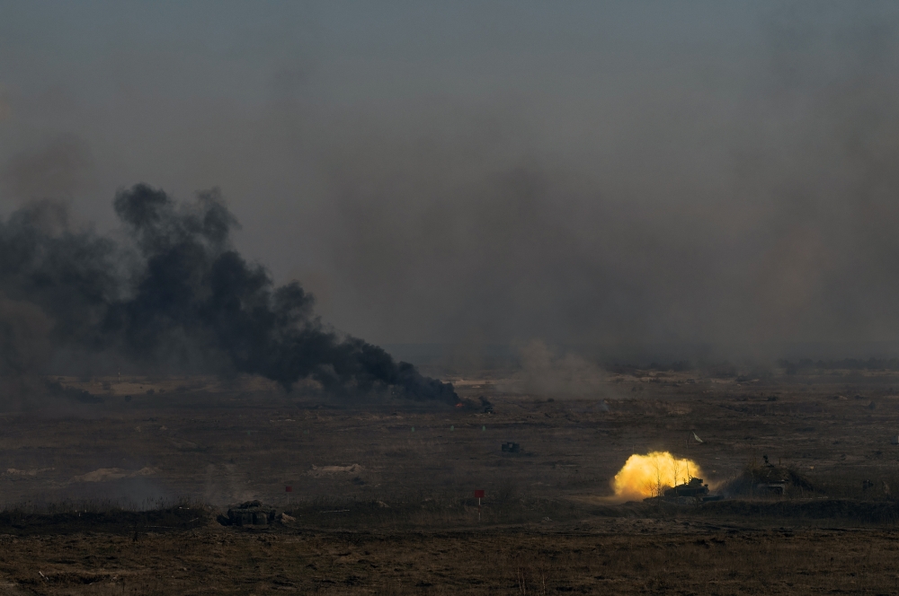 Munitions explode during military exercises on Wednesday, Feb. 16, 2022 at a Ukrainian base base near Rivne, about 60 miles from the Belarus border. (Lynsey Addario/The New York Times)