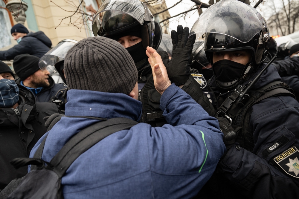 Supporters of the "save small business" movement clash with police outside the Ukrainian Parliament in Kyiv, Ukraine, Feb. 17, 2022.  (Lynsey Addario/The New York Times) 