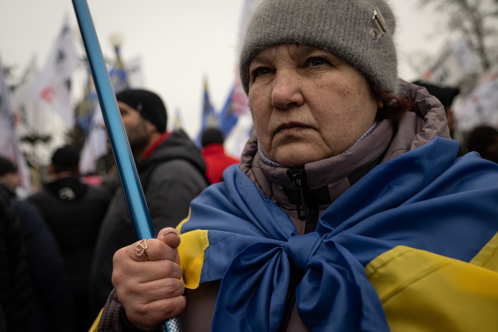 Supporters of the "save small business" movement demonstrate outside the Ukrainian Parliament in Kyiv, Ukraine, Feb. 17, 2022.  (Lynsey Addario/The New York Times) 