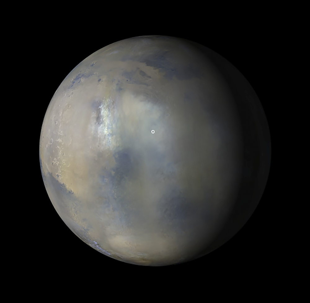 An undated photo provided by NASA/JPL-Caltech/MSSS shows images taken by the Mars Reconnaissance Orbiter during a dust storm that obscured the location of the Perseverance rover and Ingenuity helicopter (white circle). (NASA/JPL-Caltech/MSSS via The New York Times)