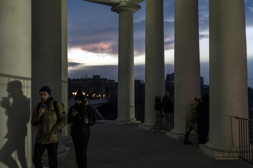 People gather to watch the sunset in Odessa, Ukraine, on Thursday, Feb. 17, 2022. President Vladimir Putin of Russia has succeeded in destabilizing Ukraine and making clear that Russia could wreck the countrys economy.  (Brendan Hoffman/The New York Times)