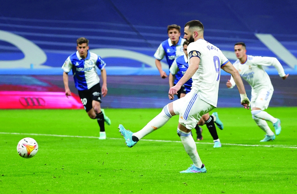 Real Madrid's Karim Benzema scores their third goal from the penalty spot. -- Reuters