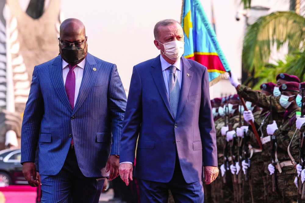 President of Democratic Republic of Congo Felix Tshisekedi greets Turkish President Recep Tayyip Erdogan at the Palais de la Nation in Lukunga district of Kinshasa. - AFP

