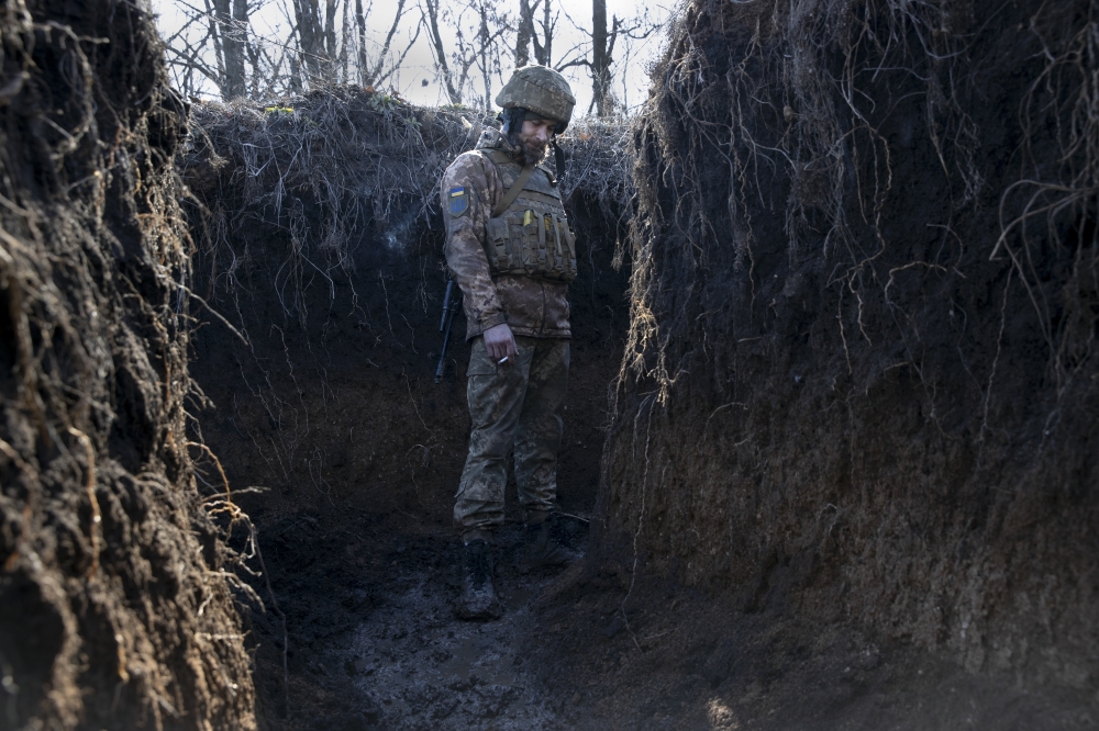 A Ukrainian soldier at a front line position, which has come under recent mortar attack, in Novozvanivka, Ukraine, Feb. 21, 2022. (Tyler Hicks/The New York Times)