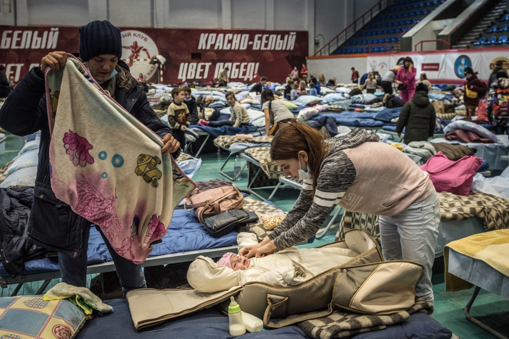 Refugees from the separatist-held territories of eastern Ukraine seen at a temporary refugee shelter in Taganrog, Russia, Feb. 20, 2022. (Sergey Ponomarev/The New York Times)