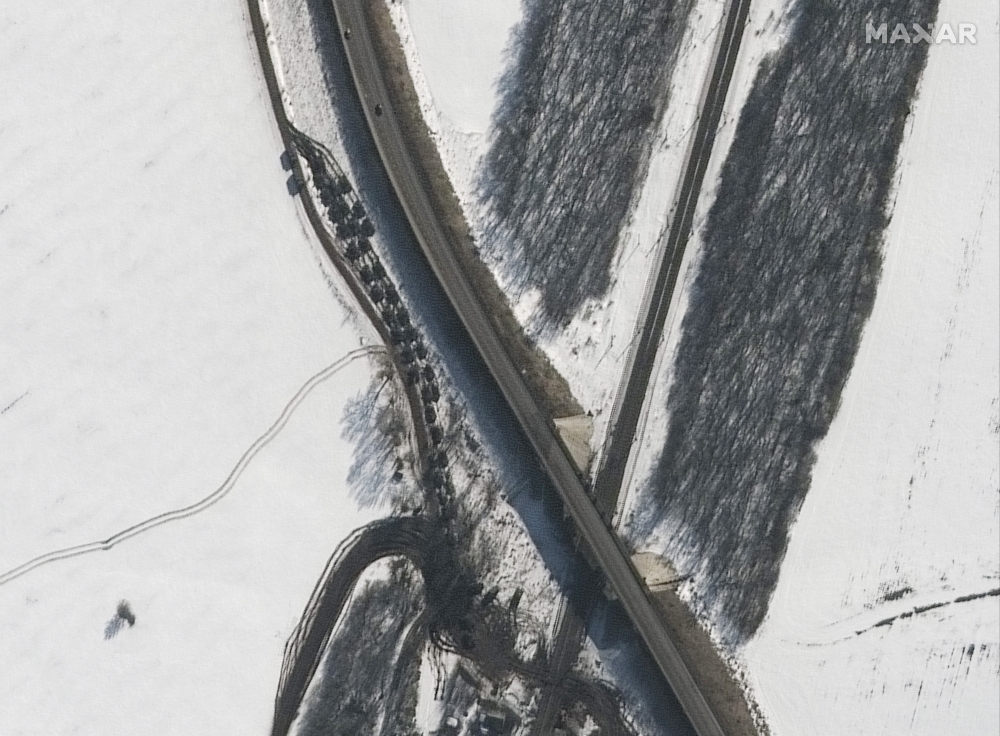 In a satellite image provided by Maxar Technologies, military vehicles moving south of the Soloti garrison in Russia, Sunday. Feb. 20, 2022. (Satellite image ©2022 Maxar Technologies via The New York Times)  