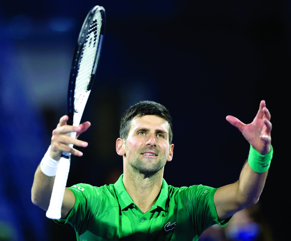 Serbia's Novak Djokovic celebrates winning his first round match against Italy's Lorenzo Musetti. -- Reuters