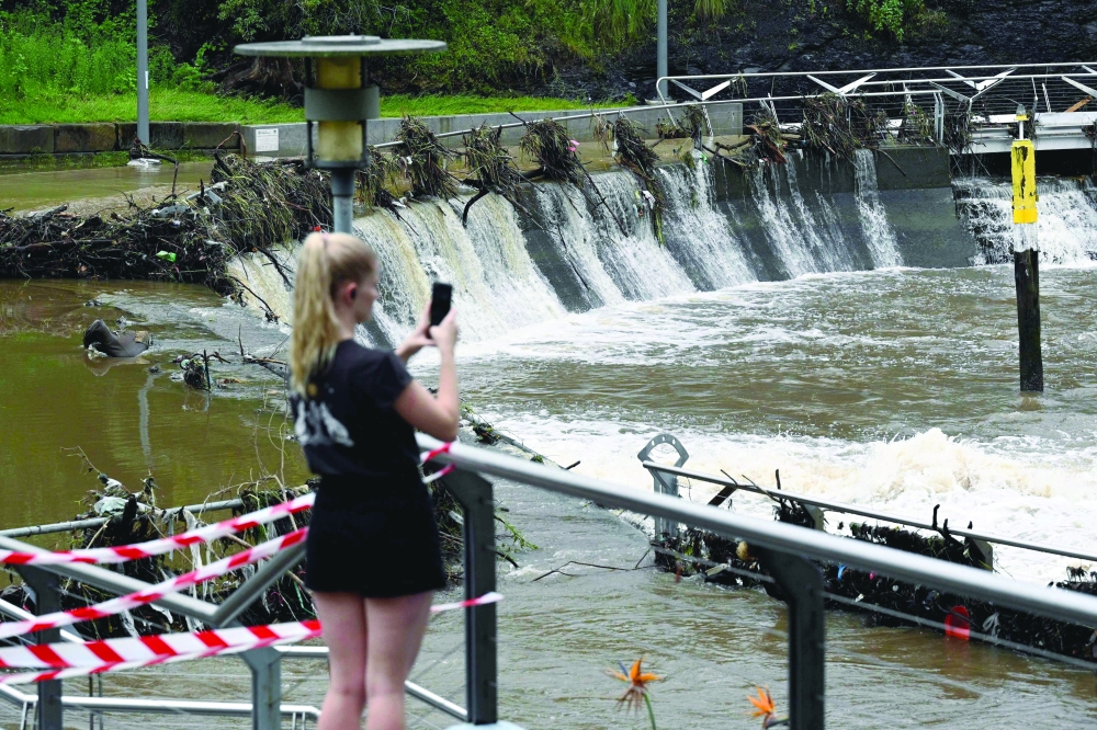 The overflowing Parramatta river at the ferry wharf in Sydney after heavy rain lashed eastern Australia, causing flash flooding and a string of emergency warnings up and down the Pacific coast. - AFP

