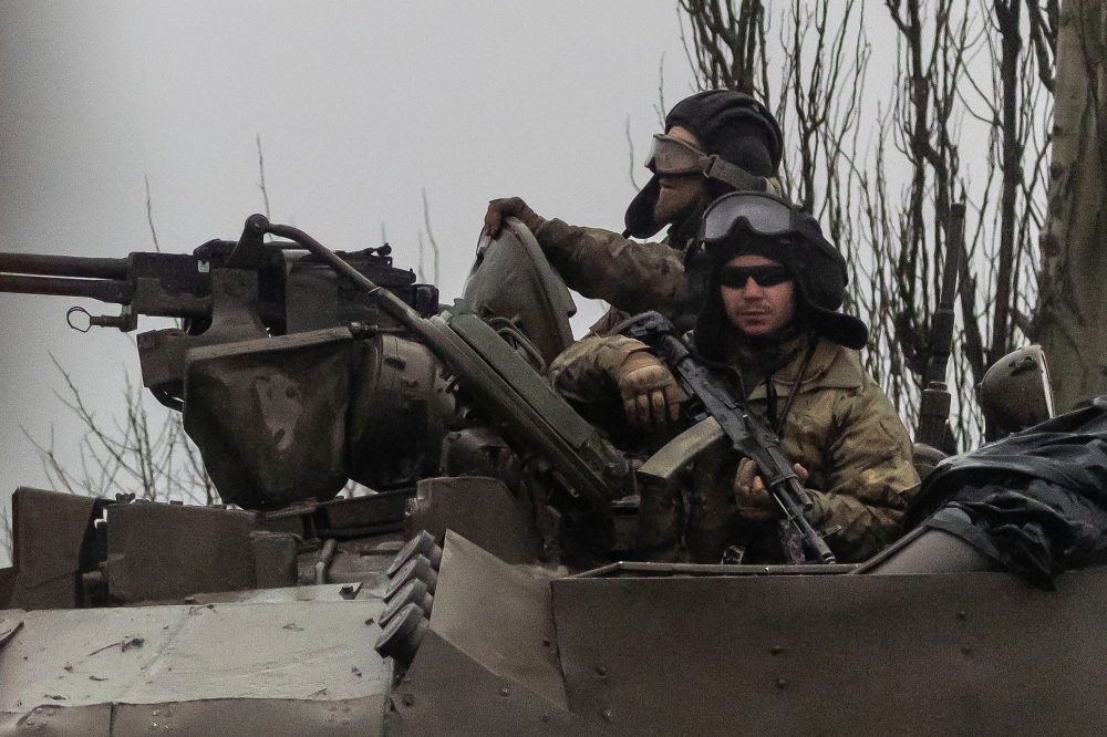 Tanks move into the city, after Russian President Vladimir Putin authorized military operation in eastern Ukraine, in Mariupol