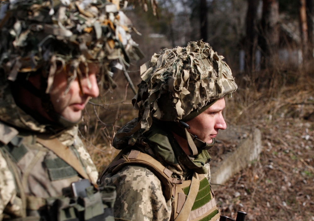 Ukrainian servicemen are seen at a position on the front line with Russia-backed separatists