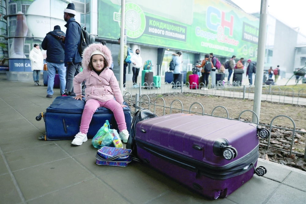 People wait to return to the city at Kyiv Airport after Russian President Vladimir Putin authorized a military operation in eastern Ukraine on Thursday. — Reuters