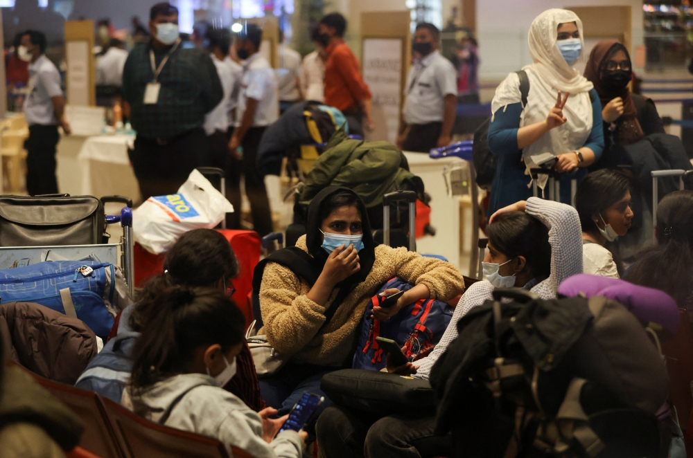 Students wait for their turn to leave the Chhatrapati Shivaji Maharaj International Airport after a special Air India flight carrying stranded Indian citizens from Ukraine landed in Mumbai
