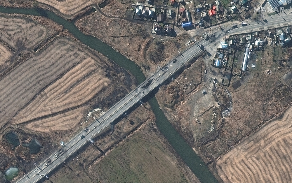 A satellite image shows a damaged bridge and destroyed armored vehicles at Irpin, northwest Kyiv