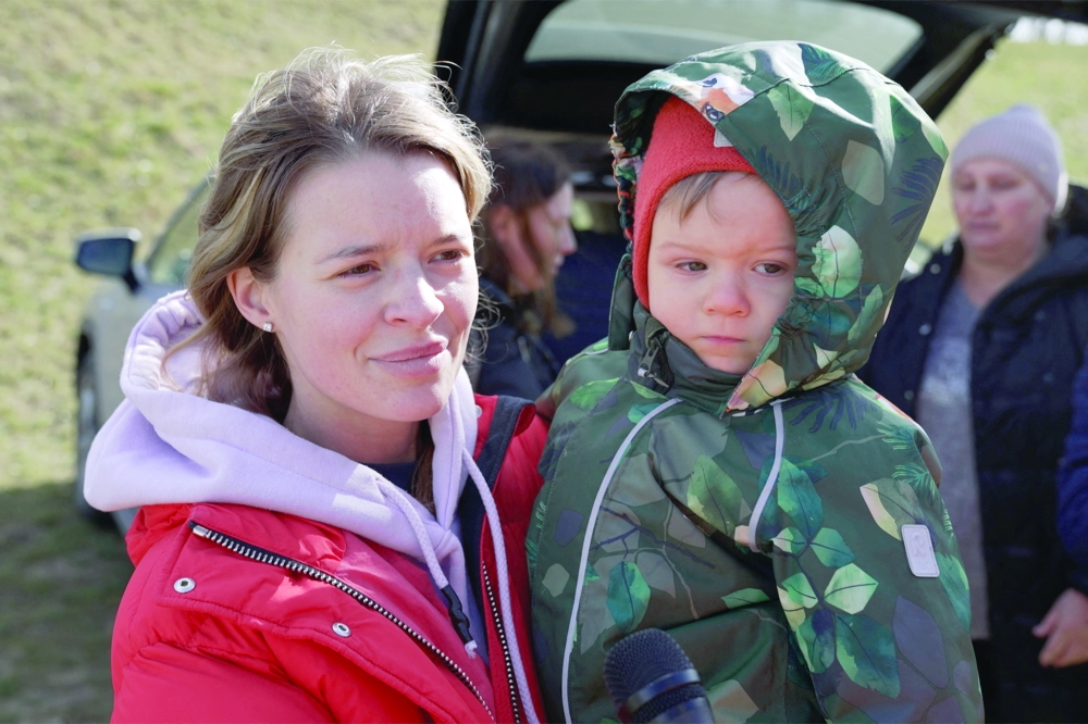 Svetlana, a Ukrainian from Kyiv, with her son Semyon 