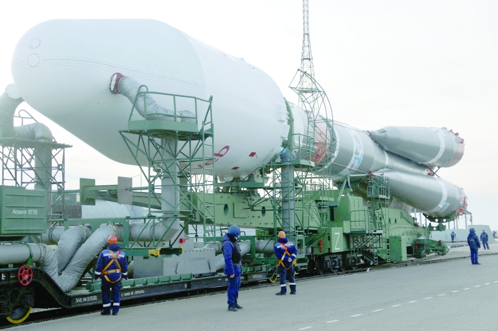 A Soyuz-2.1b rocket booster with a Fregat upper stage and satellites of British firm OneWeb is removed from a launchpad at the Baikonur Cosmodrome in Kazakhstan, after the launch was cancelled following Russia’s attack on neighboring Ukraine. -- Reuters