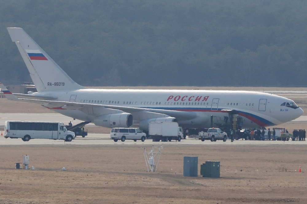 Russian government plane is serviced on a runway in the process of collecting expelled Russian diplomats at Dulles international airport in Chantilly