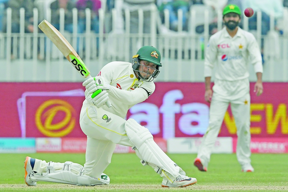 Australia’s Usman Khawaja plays a shot during the third day of the first Test against Pakistan at the Rawalpindi Cricket Stadium in Rawalpindi. 	— AFP
