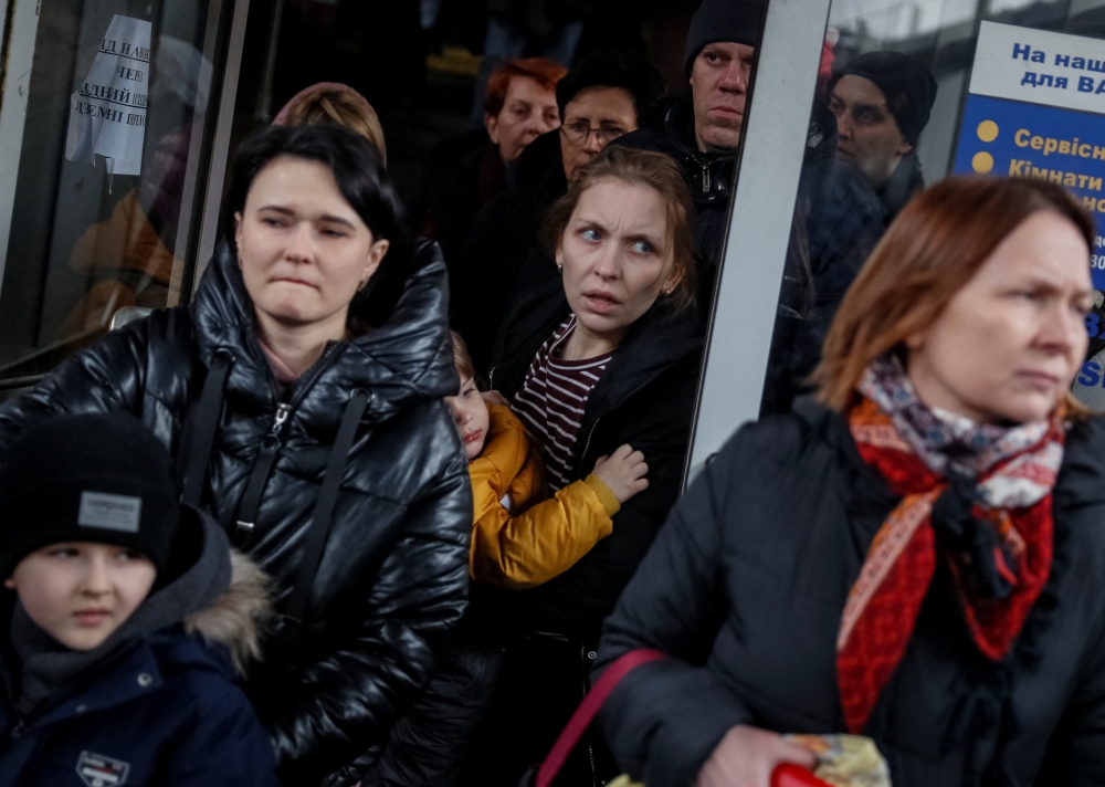 People board an evacuation train at Kyiv central train station in Kyiv