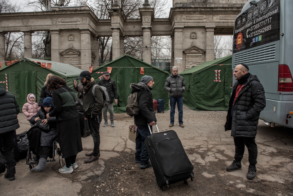Jewish Ukrainian refugees in Chisinau, Moldova, wait for buses to bring them to an airport in Romania where they will fly then to Israel, March 7, 2022. (Laetitia Vancon/The New York Times)