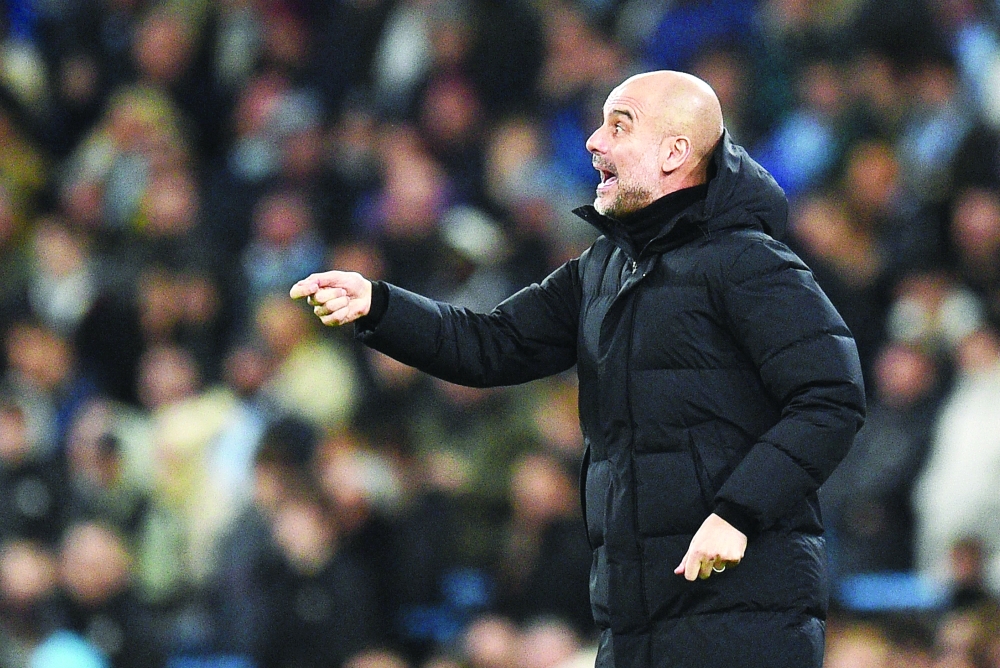 Manchester City's Spanish manager Pep Guardiola shouts instructions to his players from the touchline during the UEFA Champions League round of 16 second leg football match between Manchester City and Sporting Lisbon at the Etihad Stadium in Manchester, north west England, on March 9, 2022. (Photo by Oli SCARFF                           / AFP)

