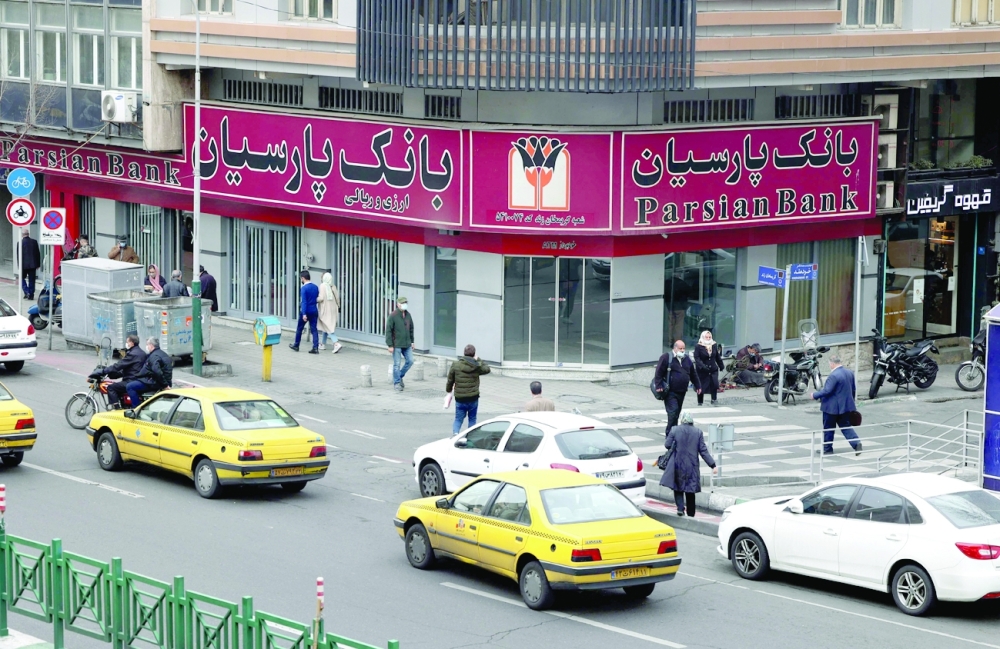 Iranians are pictured in the capital Tehran. Iran will not back down from any of its red lines in talks in Vienna, Iranian President Ebrahim Raisi said on Thursday. — AFP