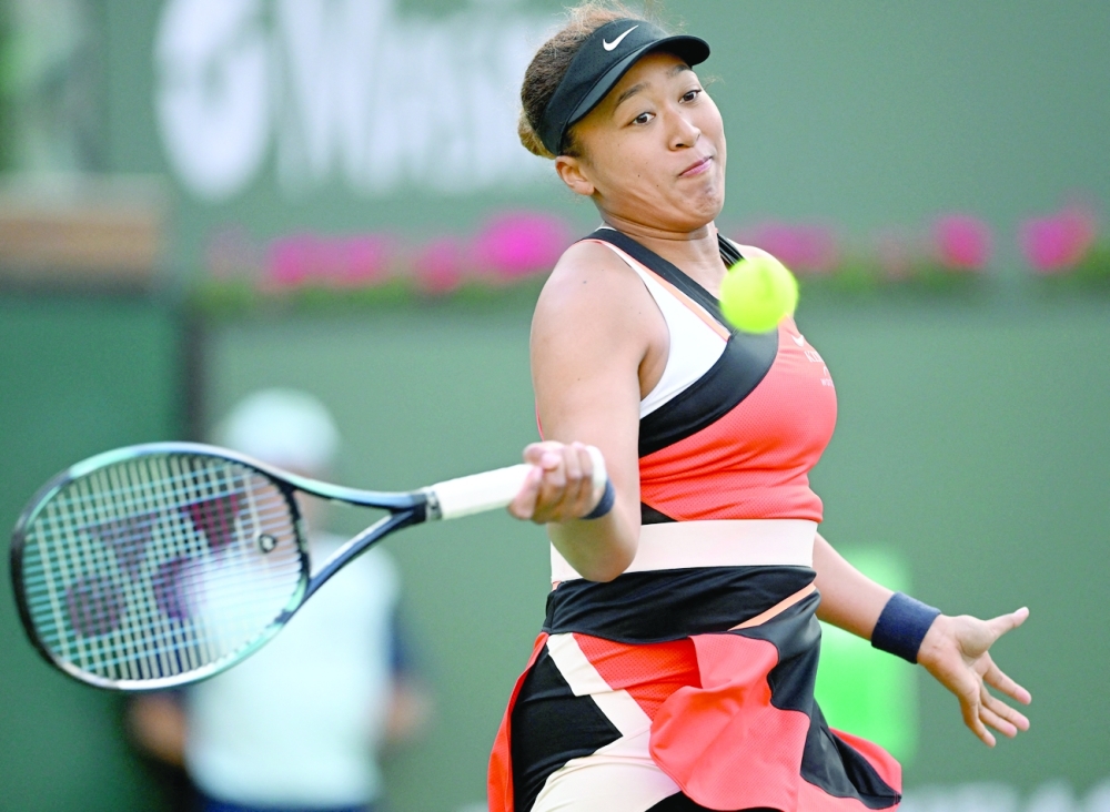 Naomi Osaka (JPN) hits a shot in her first round match against Sloane Stephens (not pictured) on day 4 at the BNP Paribas Open at the Indian Wells Tennis Garden. -- USA Today Sports
