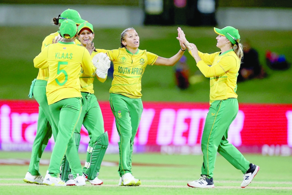 South Africa’s Shabnim Ismail (C) with team-mate celebrate their victory during the 2022 Women’s Cricket World Cup in Tauranga. — AFP
