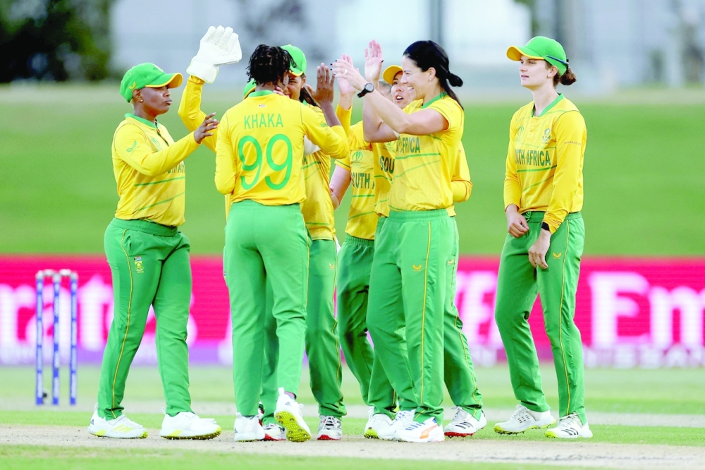 South Africa players celebrate the wicket of Pakistan's Nahida Khan during the 2022 Women's Cricket World Cup match at Bay Oval in Tauranga. -- AFP