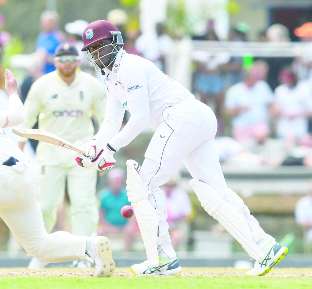 Nkrumah Bonner of West Indies hits a boundary during the third day of the first Test against England. -- AFP