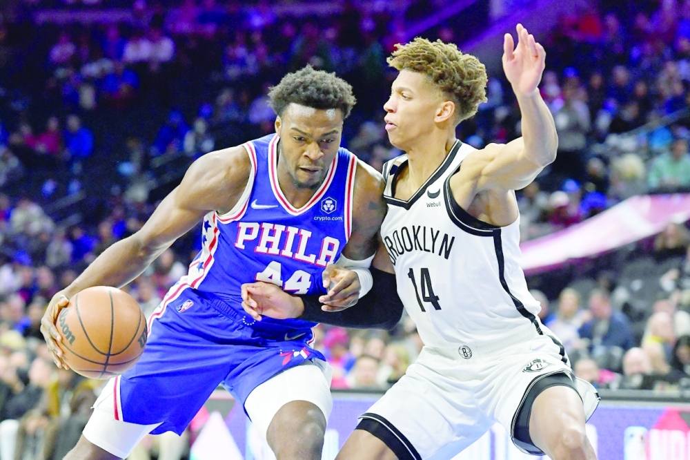 Philadelphia 76ers forward Paul Reed (44) drives to the basket against Brooklyn Nets forward Kessler Edwards (14) during the fourth quarter at Wells Fargo Center. -- USA Today Sports
