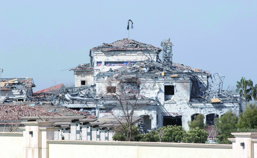 A view of a damaged building after an overnight attack in Arbil, the capital of the northern Iraqi Kurdish autonomous region. - AFP
