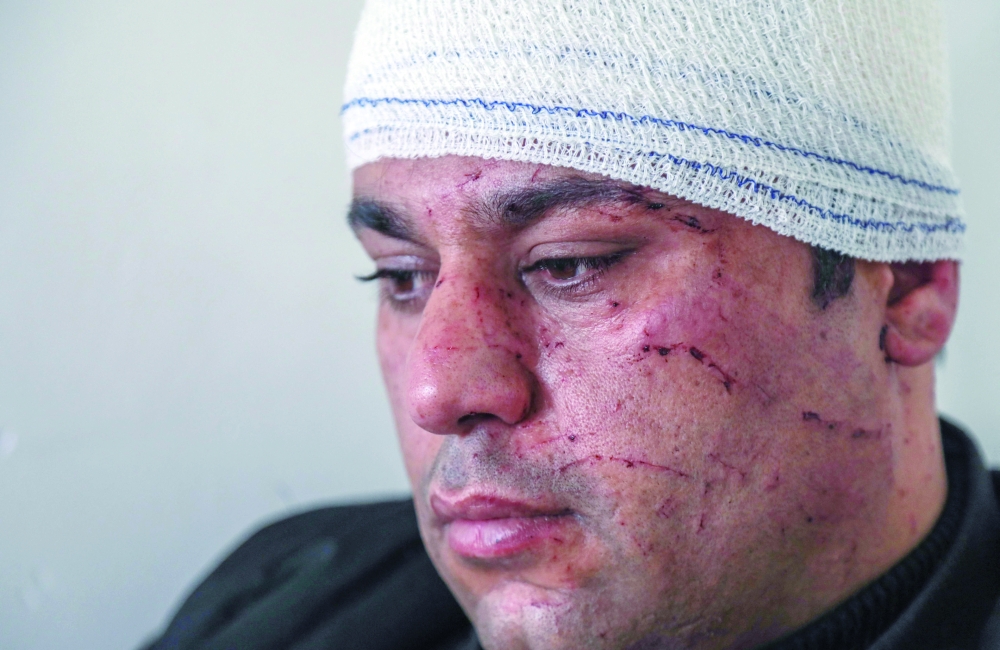 Ziryan Wazir rests after sustaining wounds in an overnight attack in Arbil. - AFP 