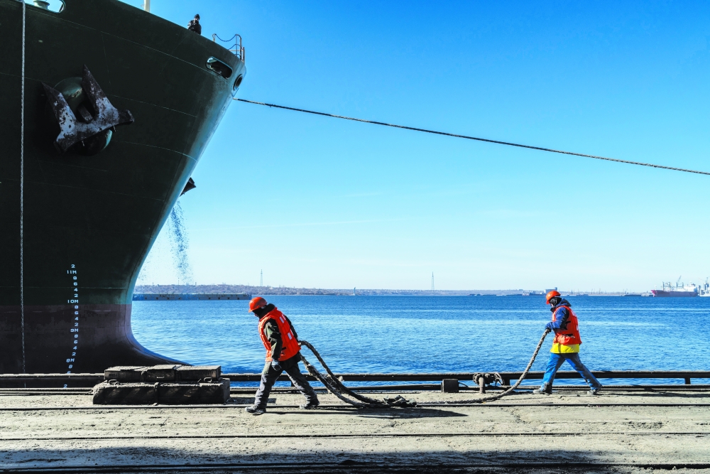 Workers are seen at the port of Mykolaiv, in Ukraine. 