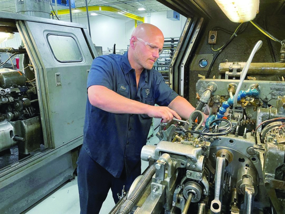 A worker operates one of the metal cutting machines at Gent Machine factory in Cleveland, Ohio.  — Reuters
