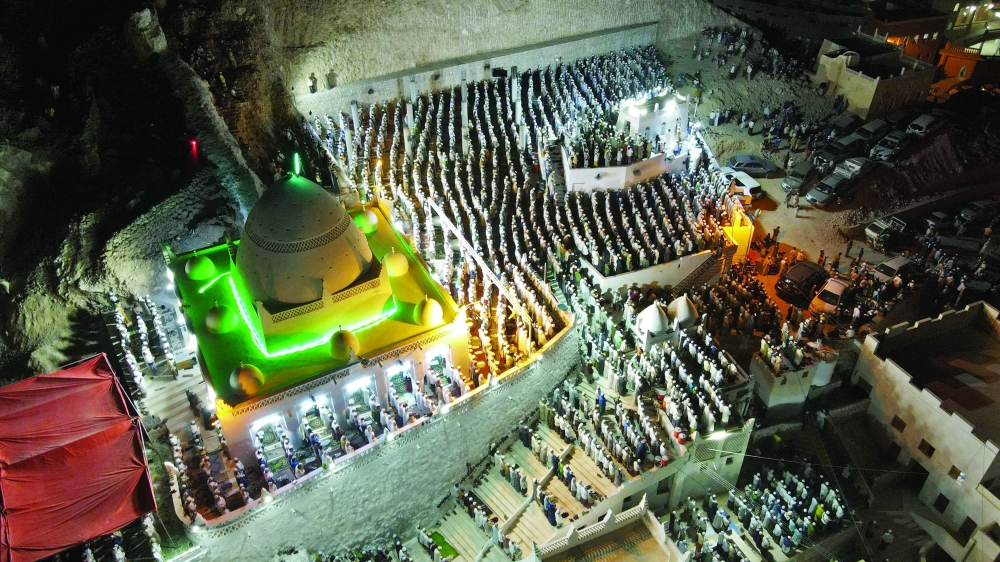 An aerial view shows pilgrims gathering at Qabr Nabi Hud in Yemen's central Hadramawt Governorate, during the four-day pilgrimage which precedes the fasting month of Ramadhan. - AFP