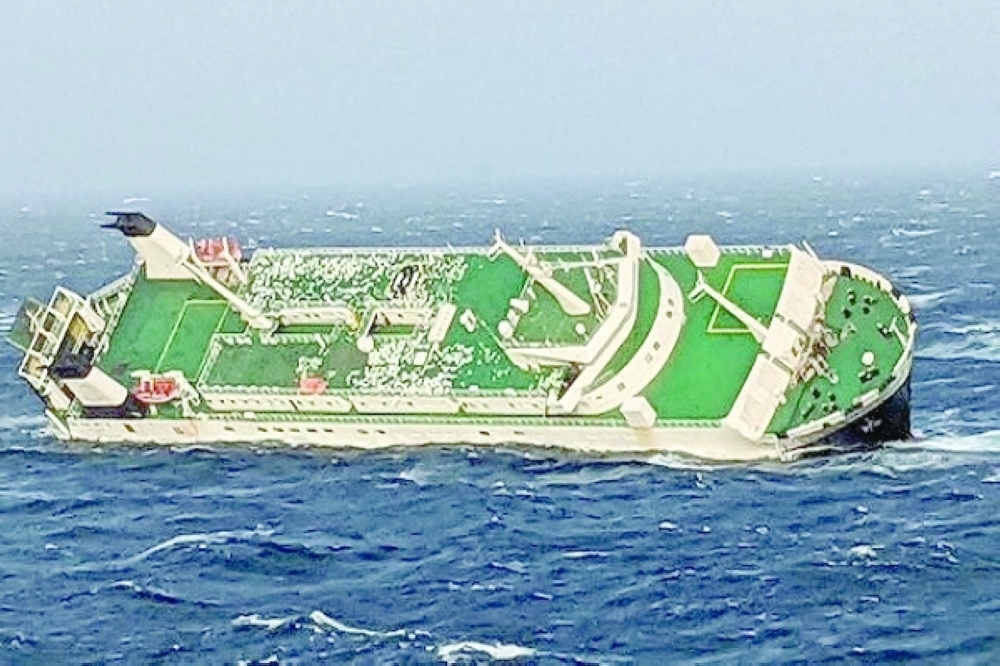 A cargo ship is seen sinking off Asalouyeh. -- Reuters