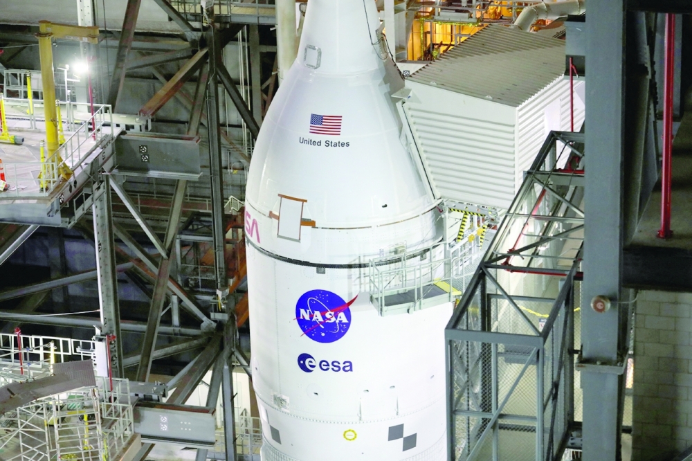 Nasa's next-generation moon rocket, the Space Launch System rocket with its Orion crew capsule perched on top, is seen in the Vehicle Assembly Building. -- Reuters