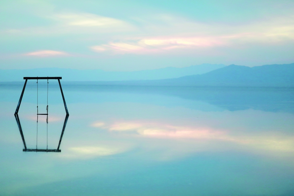 A swing set art installation in the Salton Sea is seen from Bombay Beach in California, US. Bombay Beach used to be a celebrity resort town in the heyday of the Salton Sea. It is a small town that lies at 223 feet below sea level and nowadays has a population of fewer than 300 people. -- Reuters