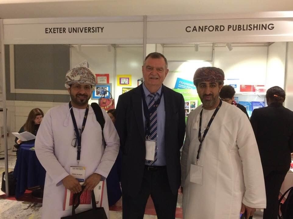 Richard with Omanis at Canford Publishing stall