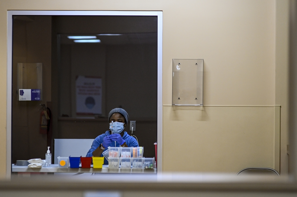 A nurse prepares vaccine boosters at a COVID center in Washington, on Feb. 4, 2022. (Kenny Holston/The New York Times)