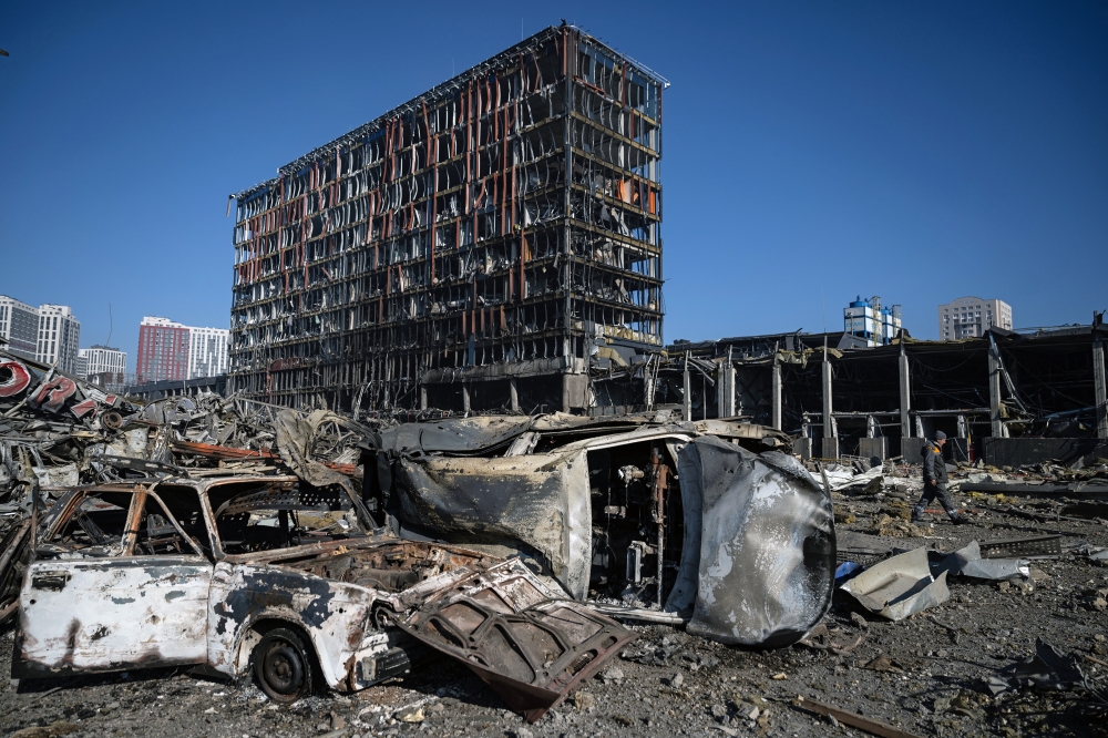 The scene after a Russian missile strike reduced a sprawling shopping mall in Kyiv to a smoldering ruin on Monday, March 21, 2022, one of the most powerful strikes to rock the center of the Ukrainian capital since the war began last month. (Lynsey Addario/The New York Times)