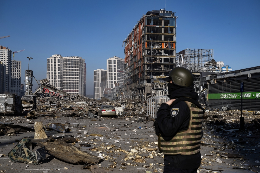 The scene after a Russian missile strike reduced a sprawling shopping mall in Kyiv to a smoldering ruin on Monday, March 21, 2022, one of the most powerful strikes to rock the center of the Ukrainian capital since the war began last month. (Lynsey Addario/The New York Times)