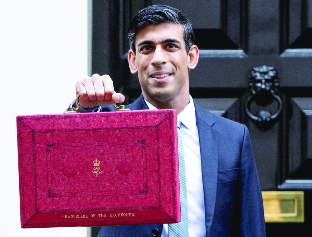 Britain's Chancellor of the Exchequer Rishi Sunak holds the budget box outside Downing Street in London, Britain, in this file photo. 
— Reuters