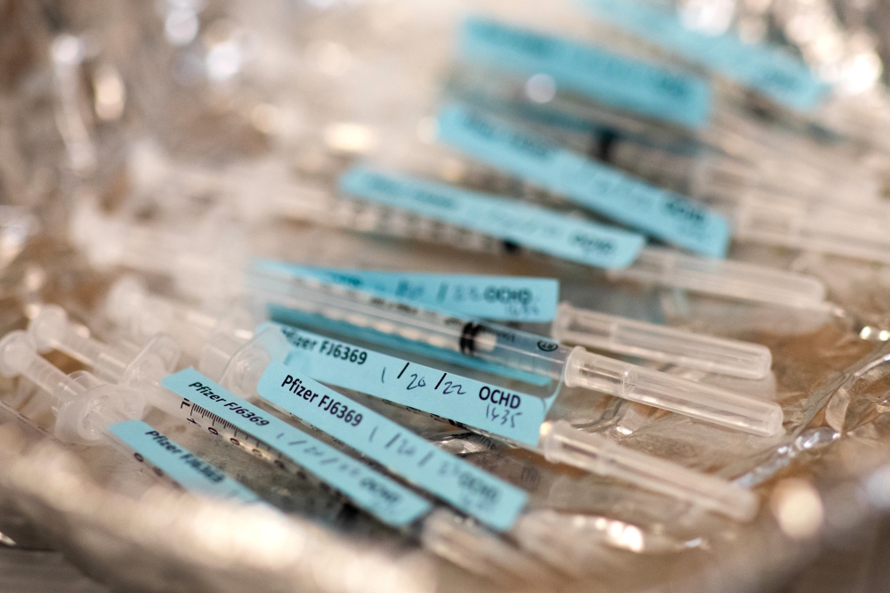 Syringes of the COVID-19 made by Pfizer/BioNTech  vaccine for a vaccination site at a high school in Berkley, Mich., Jan. 20, 2021. (Emily Elconin/The New York Times)