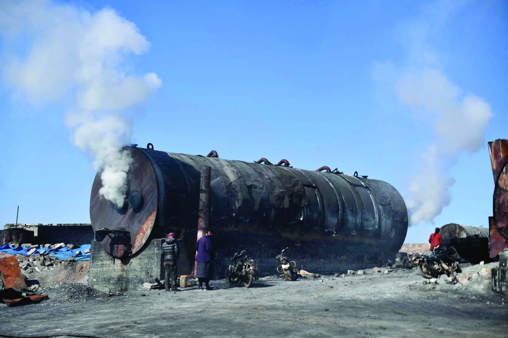 A makeshift oil refining installation near the city of Al Bab in the north of the Aleppo province. - AFP

