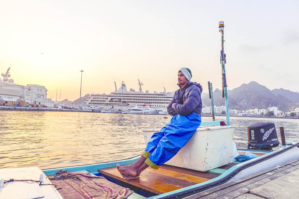 Muttrah First Market Area - A man in boat