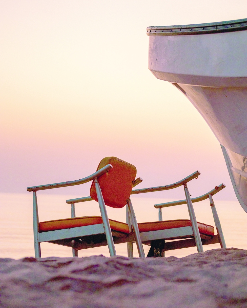 Al Bustan Beach - Boat and chairs during Sunrise