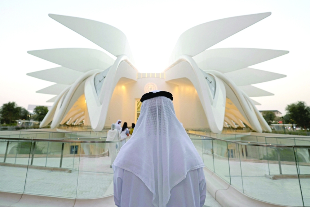 A visitor stands outside the Emirates Pavilion on the last day of Expo 2020 in Dubai. -- AFP
