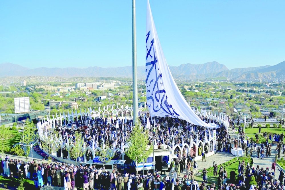 People gather at the venue for a flag hoisting ceremony of the Taliban flag on the Wazir Akbar Khan hill in Kabul. -- AFP